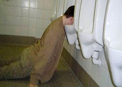 passed_out_drunk_urinal.jpg