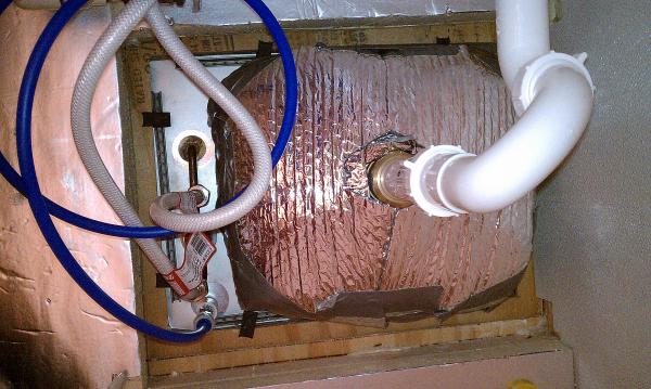 Under the sink.  Lots of Reflectix.