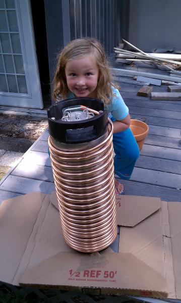 Wrapping 50' of 1/2" Refrigeration coil around a Corney with some help from the world's foremost 6-year old expert on beer aroma.