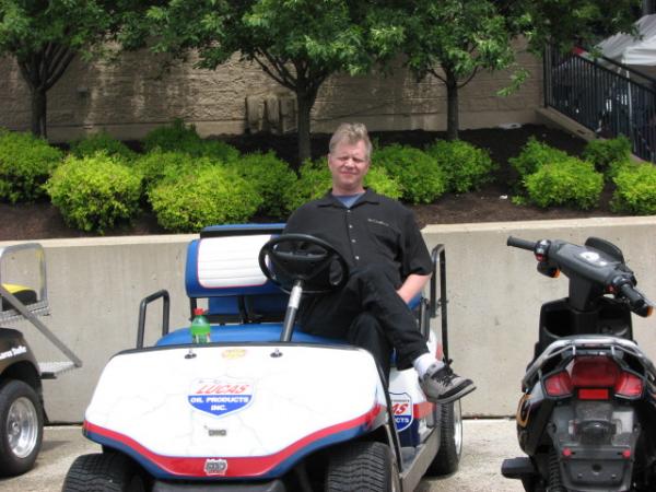Relaxing on golf cart at nhra