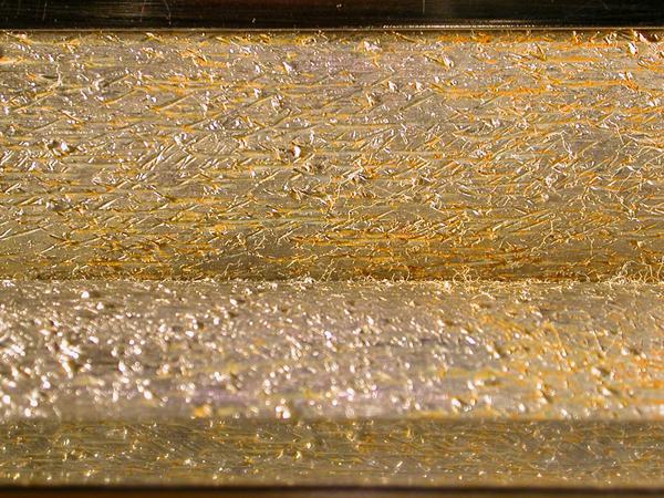 roller close-up, roughed up with 1/4" drill bit