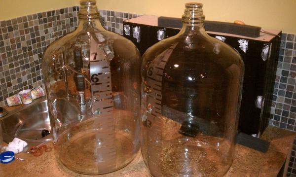 Etched graduated carboys.