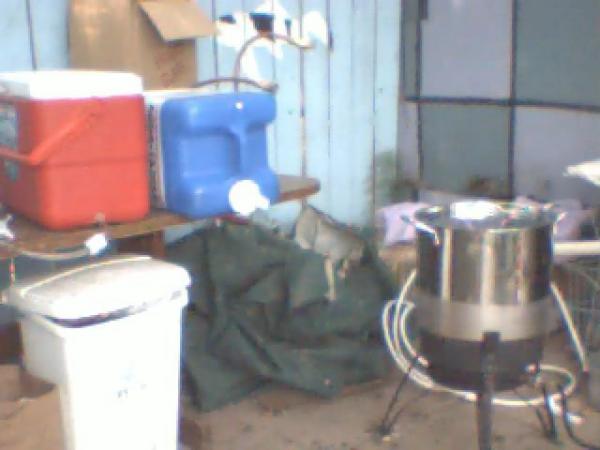 Brew Setup - This is the main setup I have been using for years.  the red cooler is my mash tun, the blue jug is a fresh water jug where I store my filtered water for use, and the of course my SS kettle.