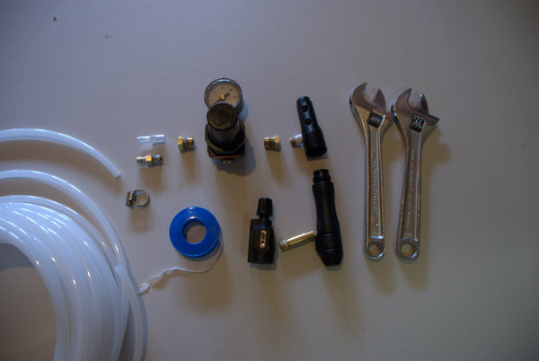 Tools:
Two Adjustable wrenches
Teflon Tape (more of a supply but whatever, use thread sealant of your choice)

Parts:
Planet Eclipse Inline High Pressure Reg (free part)
Planet Eclipse OOPS (free part)
ASA adapter (free part)
Generic Air Compresso