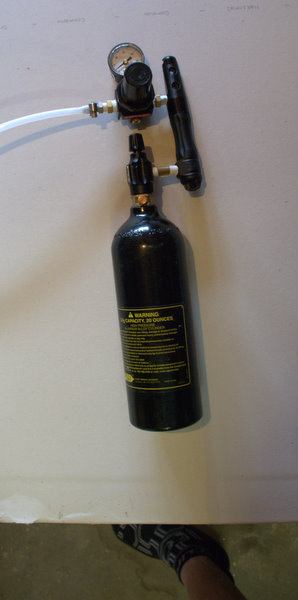 Here is the completed assembly with a co2 tank.  After a long day of paintball, either a tournament paintball or 26hr scenario paintball game you are now ready for a nice cold beer.  Usage is simple:

1.  Attach tank to regulator and hose to keg co2 in