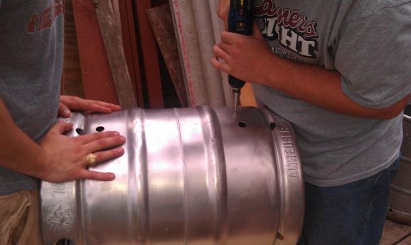 Mash Tun with both 1/2 inch ports drilled, and now drilling for it's thermometer.