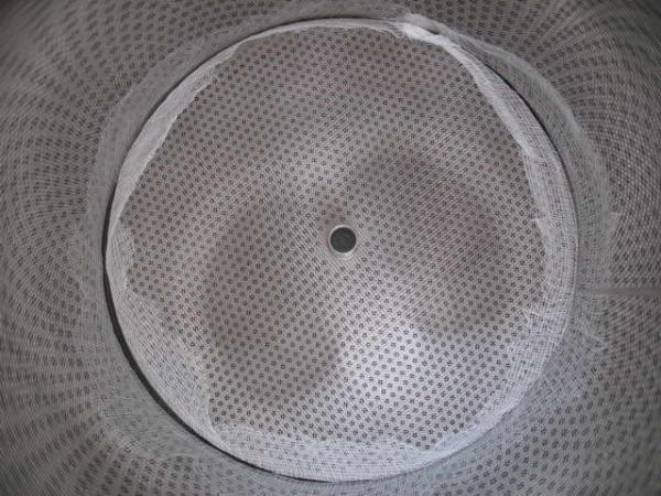 Cheesecloth wrapped around ss filter and steel plate.