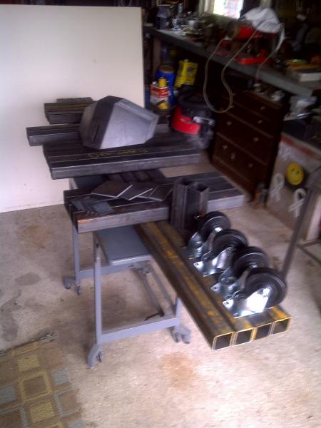 2 in sq steel tube (.125 wall), .125" brackets and 4" casters from Fazios