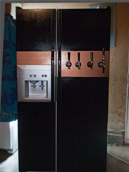 Kegerator I am working on for my husband.  Nearly finished.  Paint gave me fits because I was doing it in the garage and could not keep the @#$@#$ specks from flying about. Oh well, it is for beer, not to take out on a date.  It took him a day to get exci