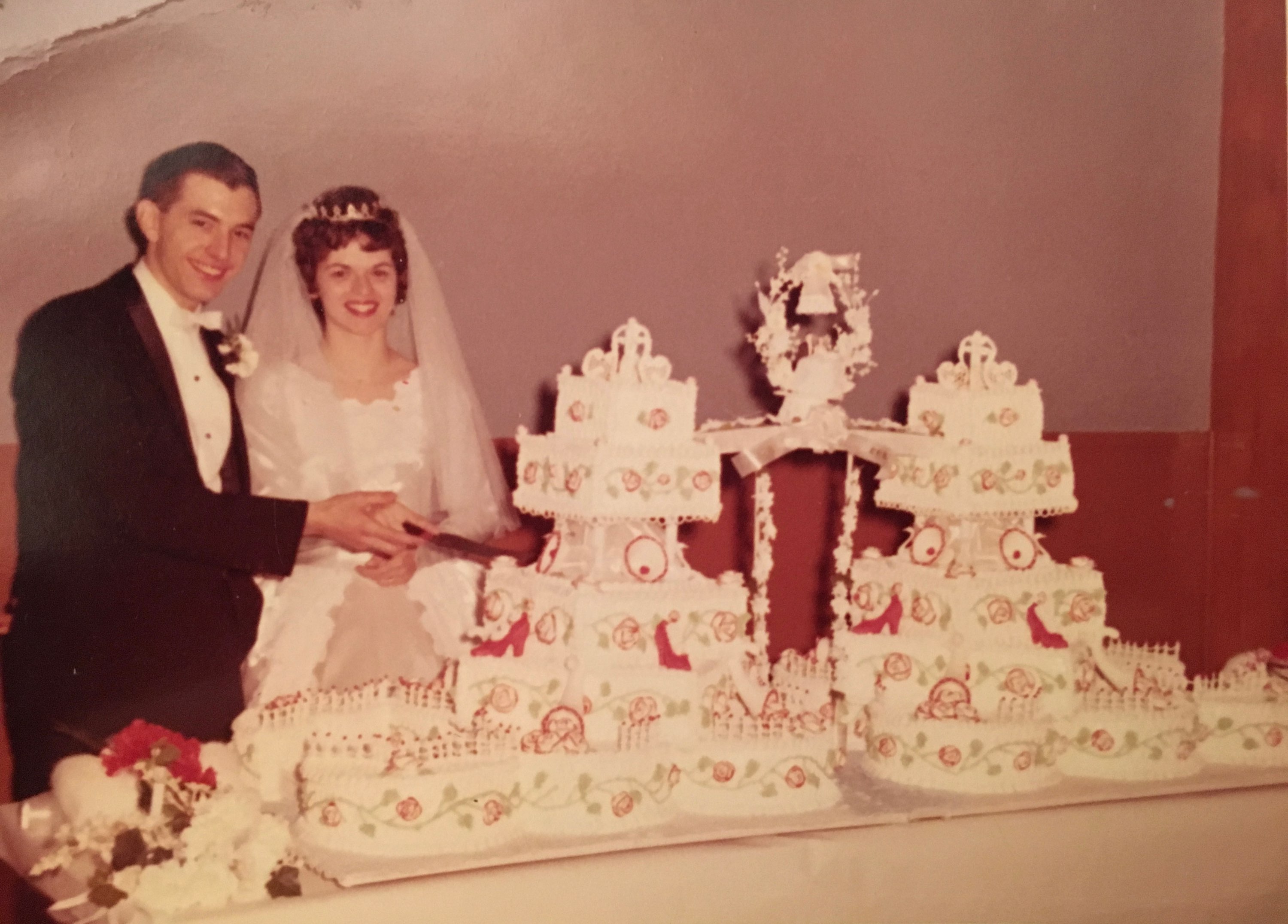 mom and dad wedding with cake.jpg