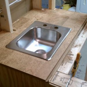 Dryfit of the fixed portion of the lid with cork surface material and sink.