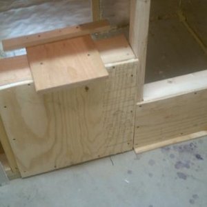 From the utility room, looking at the back of the bar.  The platform is for the air conditioner.  The lower bulkhead to the right will have a removable panel for access to the area under the fixed section of countertop.