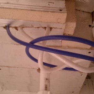 The underside of the sink is completely boxed off with insulation.  Kinda messed up looking, but there is a water supply shut off just to the right of this and I needed to be able to get to it.
