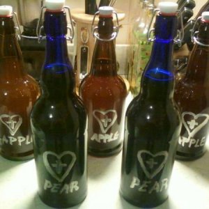 some of my pear and apple ciders in fliptop bottles