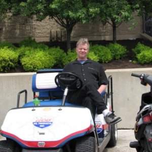 Relaxing on golf cart at nhra