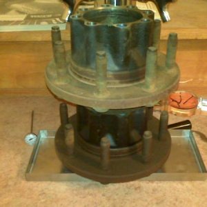 The standard bolt through drain pan fitting wouldnt work, so I glued the drip pan down with silicone adhesive and used my extra f250 hubs to hold it in place.