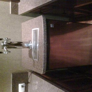 This is a pic of the finished kegerator complete with a dual tap tower, drip tray and a granite top that I installed.