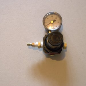 Here is the Secondary Regulator.  This is simply an air compressor regulator with an internal bleed off for lowering the pressure when needed.  It is rated between 0-150psi max.    Because Co2 has such a high pressure the primary regulator has to drop the