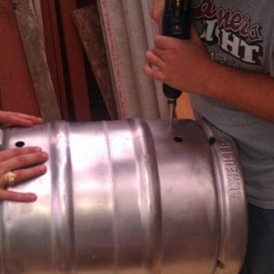 Mash Tun with both 1/2 inch ports drilled, and now drilling for it's thermometer.