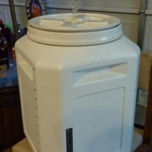 13 Gallon Vittles Vault fermenter.  Has two holes drilled in lid. One for the airlock and the other for a thermowell (not included).  It is also drilled at the bottom for using a Better Bottle valve assembly (not included). I have included a valve, but it