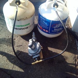 Here is our "High-to-low" pressure regulator. It is a modle normally made for house and it is written on it that can handle between 9 to 13 WC but is supposed to be set on providing 11WC. I'll update the info with the model numer later.