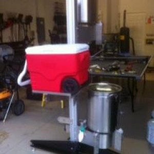 top tier with a burner on top and bottom, cooler platform in middle. March pump and therminator on other side of bottom burner