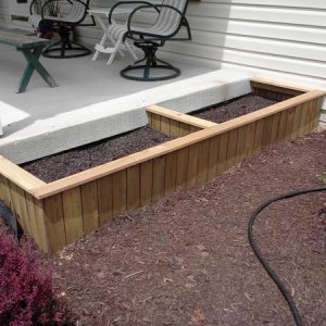 Planting beds made from a broken piece of cedar fencing and a couple pieces of cedar 1X4